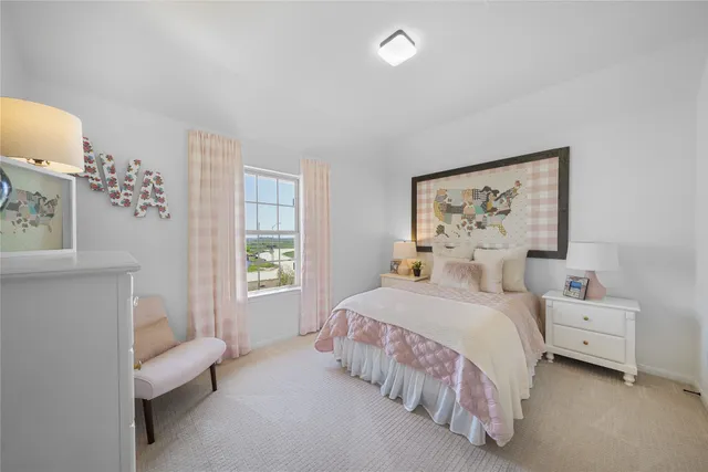 a bedroom with furniture and a book shelf