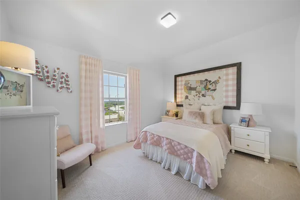 a bedroom with a bed furniture and window