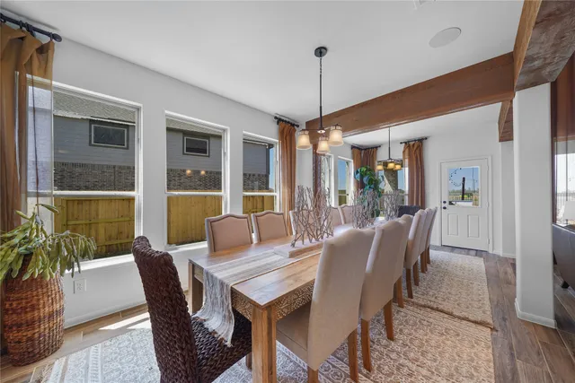 a kitchen with refrigerator and cabinets