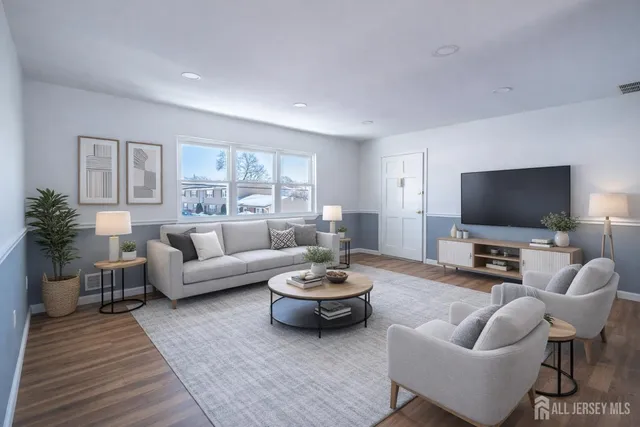a living room with furniture and a flat screen tv