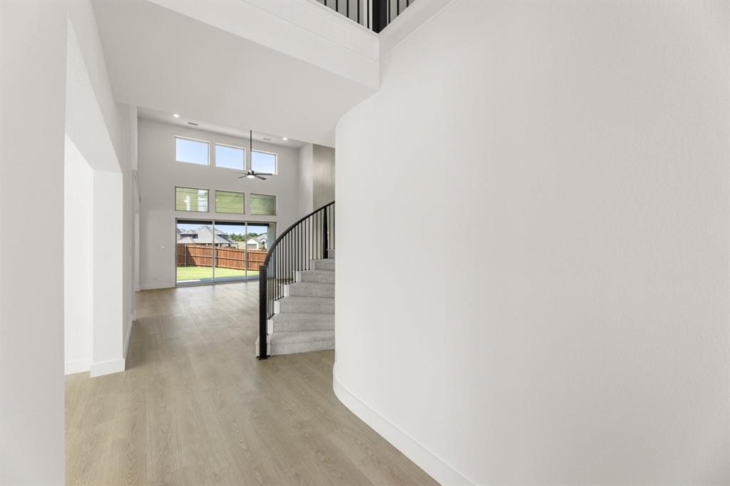 1617 Whisperwood Way Midlothian, TX 76065 - Photo 13 of 40 a view of entryway and hall with wooden floor
