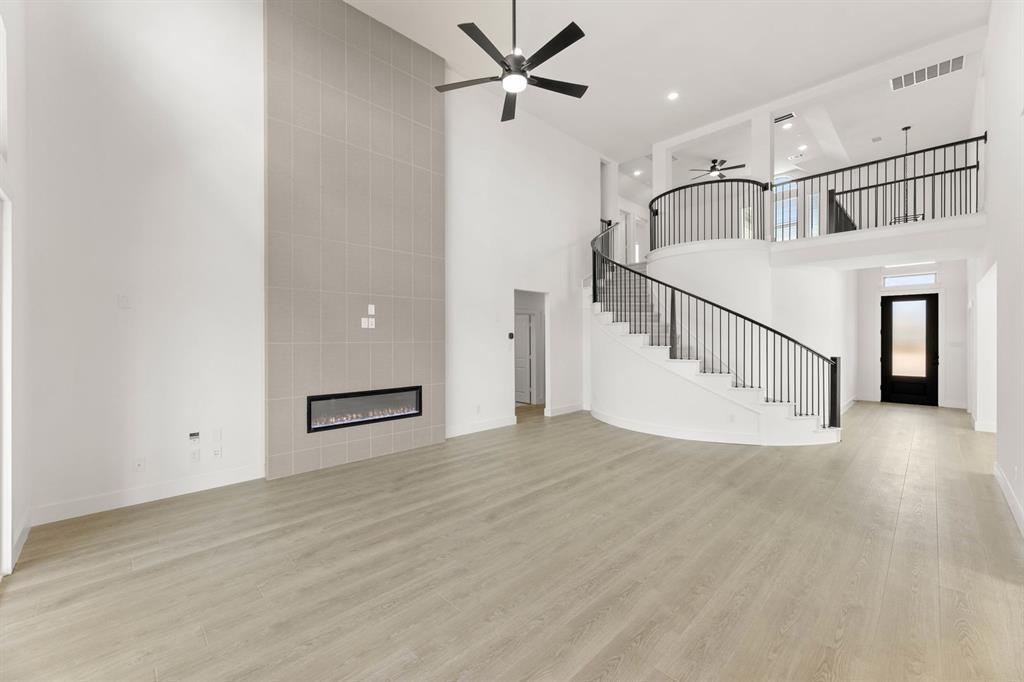 1617 Whisperwood Way Midlothian, TX 76065 - Photo 15 of 40 a view of a livingroom with a ceiling fan