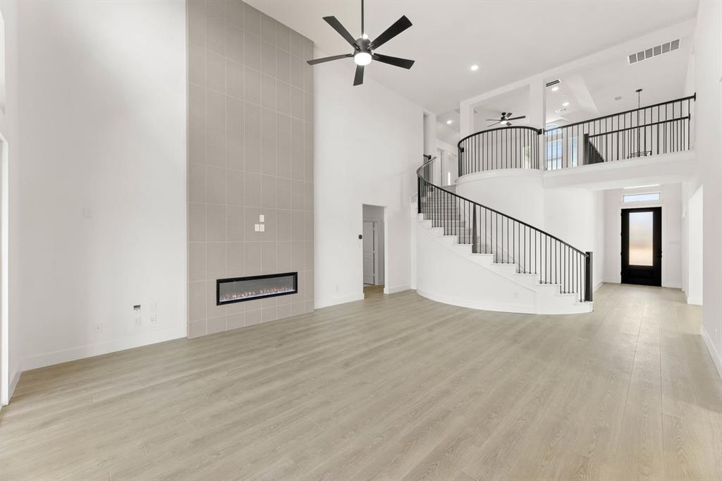 1617 Whisperwood Way Midlothian, TX 76065 - Photo 20 of 40 a view of a livingroom with a ceiling fan
