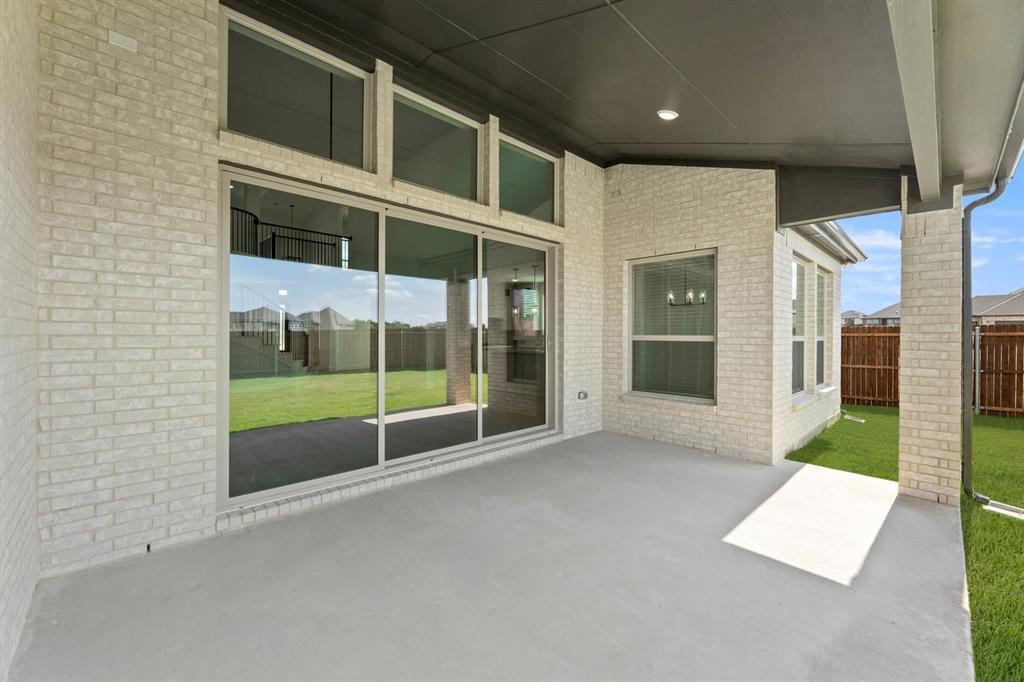 1617 Whisperwood Way Midlothian, TX 76065 - Photo 6 of 40 a view of an empty room with a sliding door