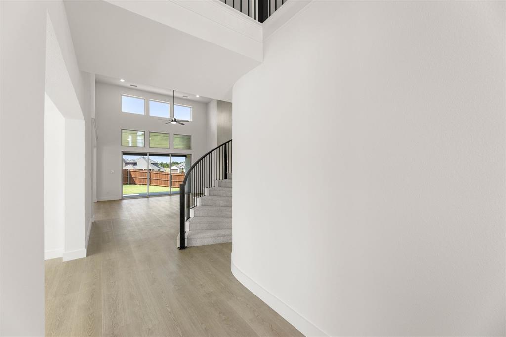 1617 Whisperwood Way Midlothian, TX 76065 - Photo 7 of 40 a view of entryway and hall with wooden floor