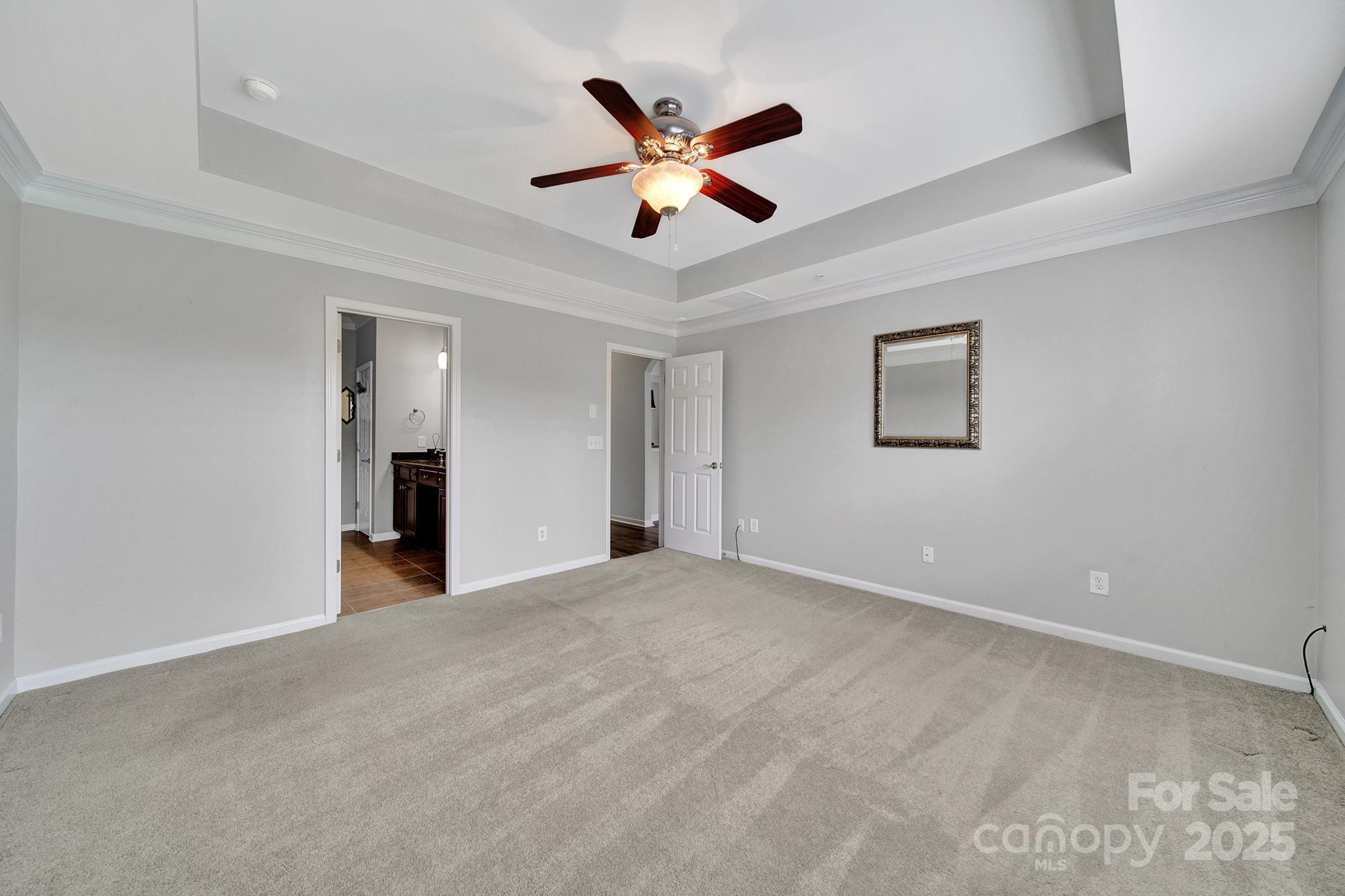 314 Wave Crest Drive Tega Cay, SC 29708 - Photo 17 of 39 a view of an empty room with a ceiling fan