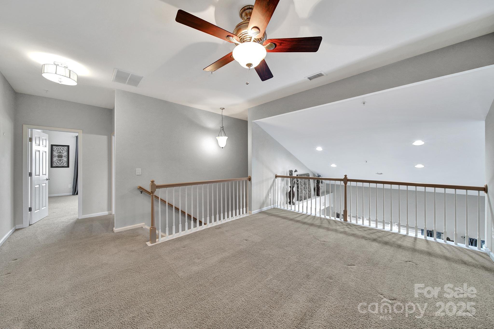 314 Wave Crest Drive Tega Cay, SC 29708 - Photo 22 of 39 a view of a livingroom with a ceiling fan and window