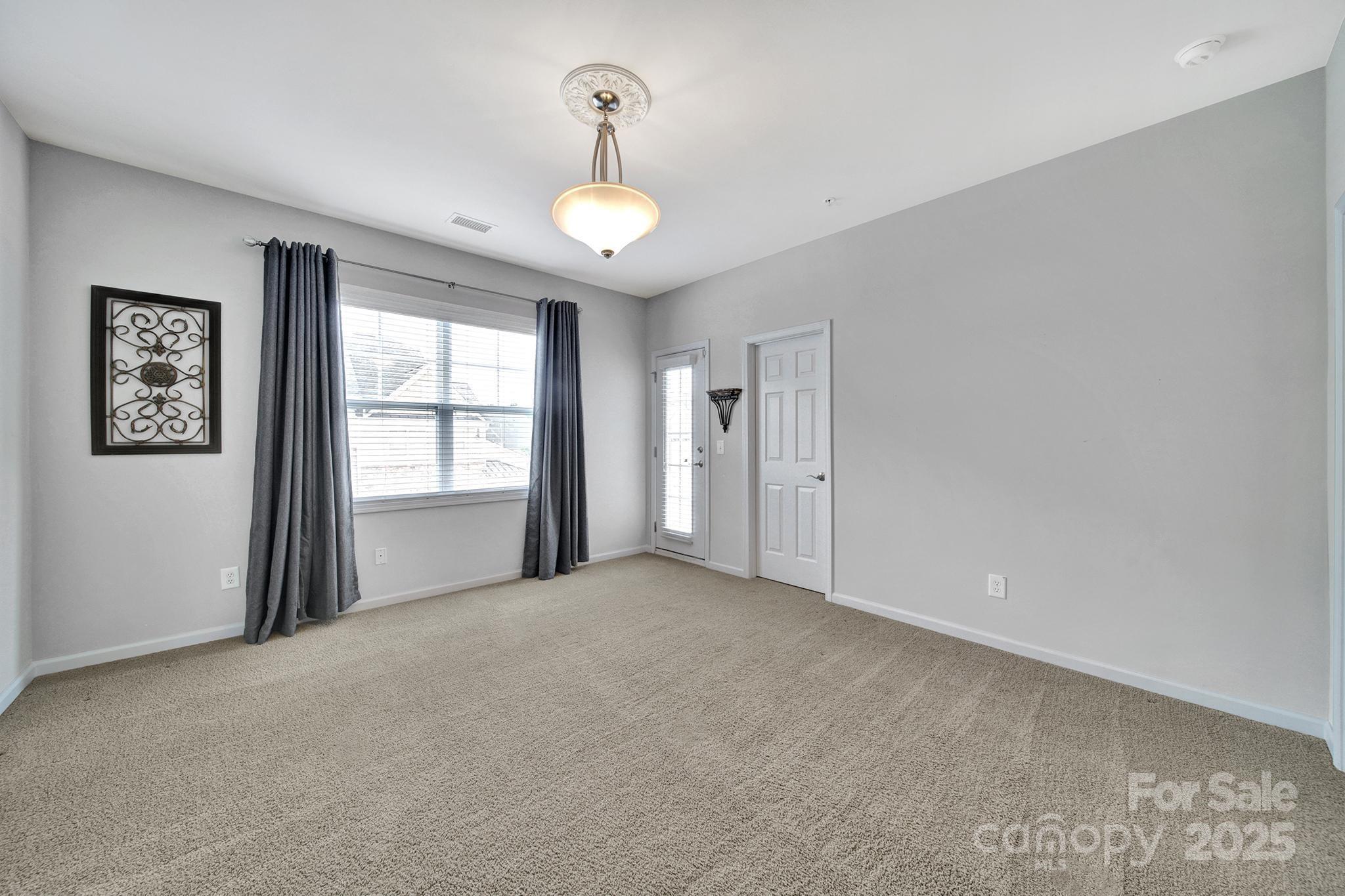 314 Wave Crest Drive Tega Cay, SC 29708 - Photo 24 of 39 a view of an empty room with a window