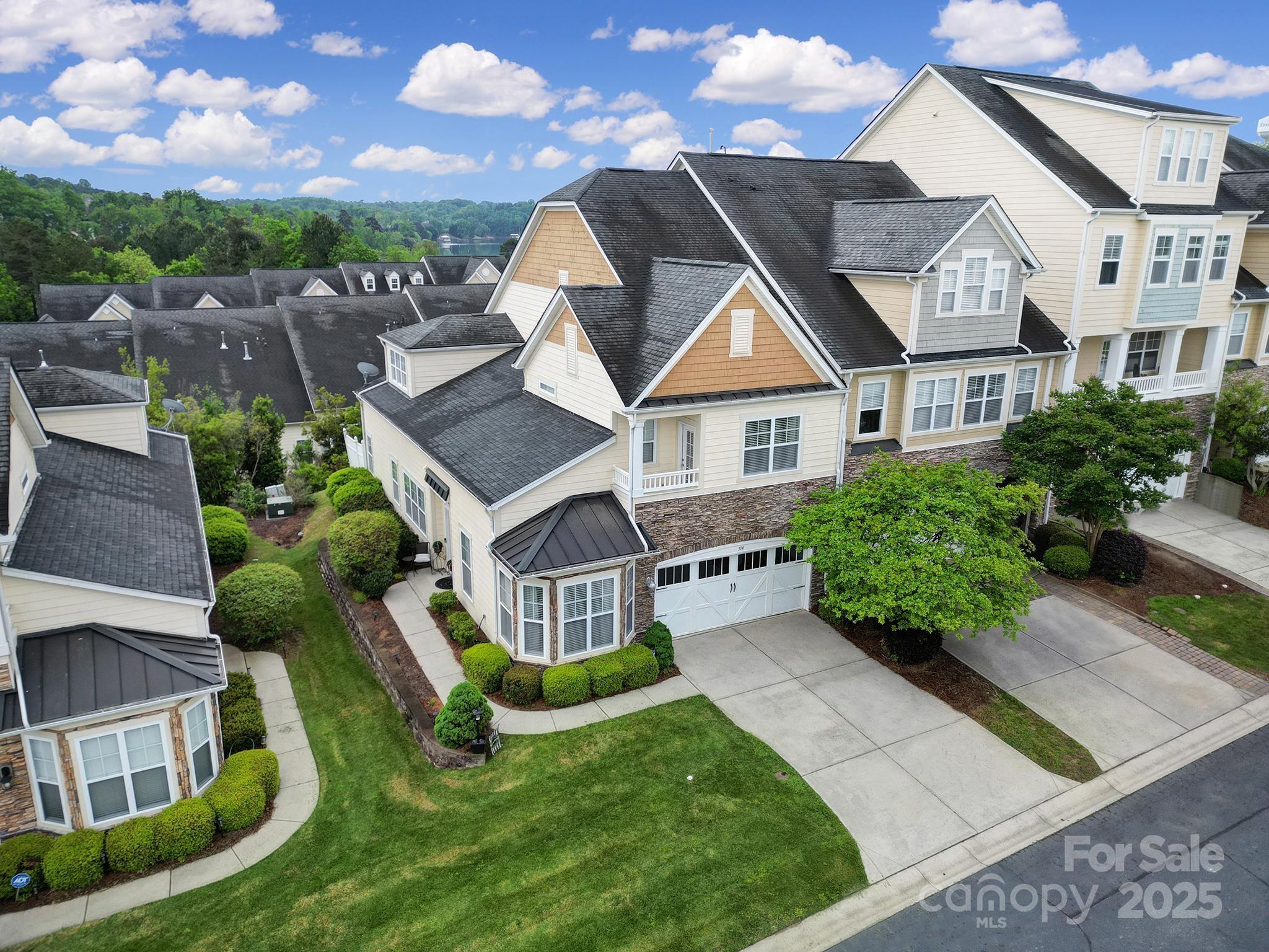 314 Wave Crest Drive Tega Cay, SC 29708 - Photo 38 of 39 an aerial view of a house with swimming pool and garden