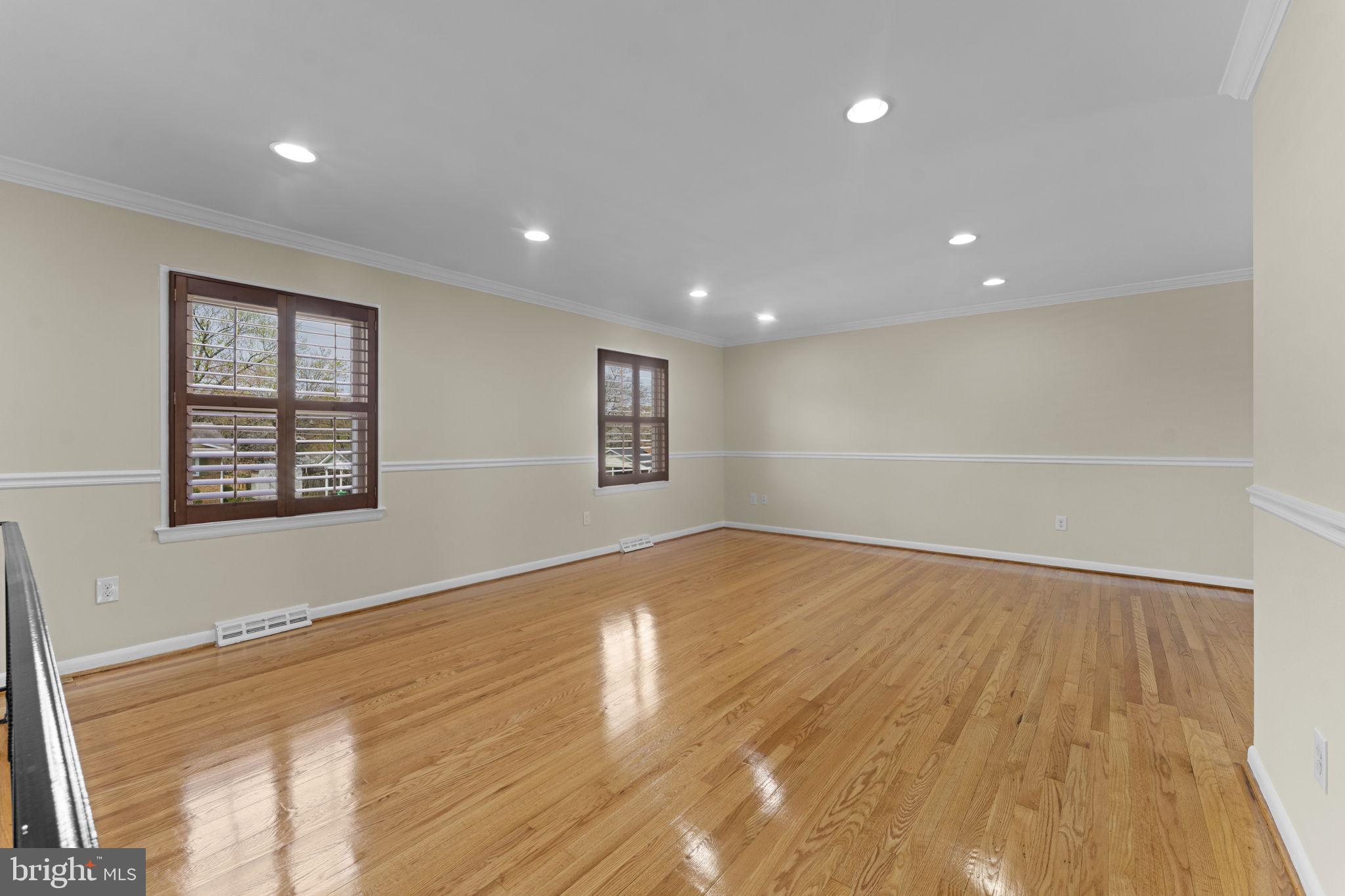 3003 Raymond Court Fort Washington, MD 20744 - Photo 15 of 30 an empty room with wooden floor and windows