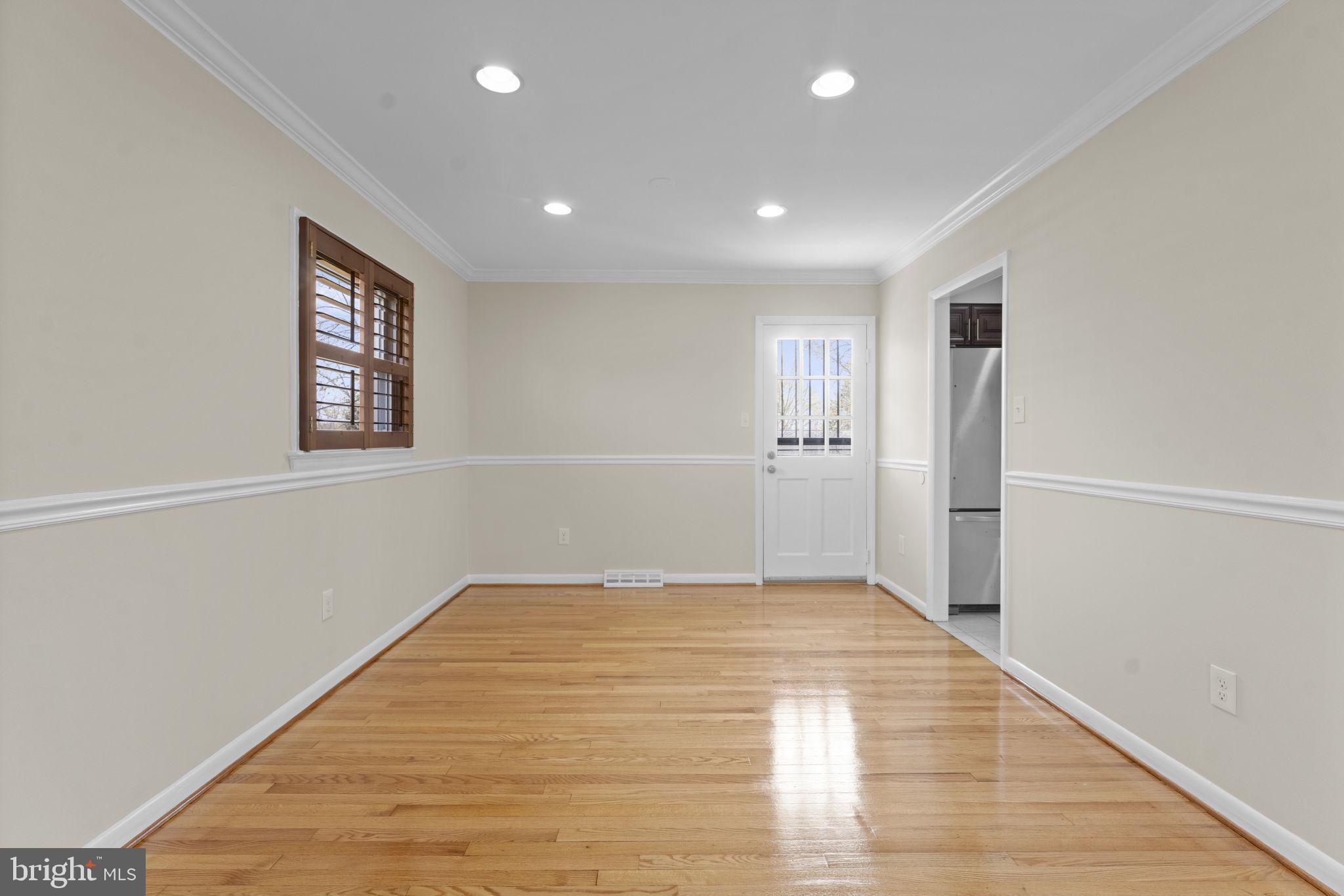 3003 Raymond Court Fort Washington, MD 20744 - Photo 16 of 30 a view of an empty room with wooden floor and a window