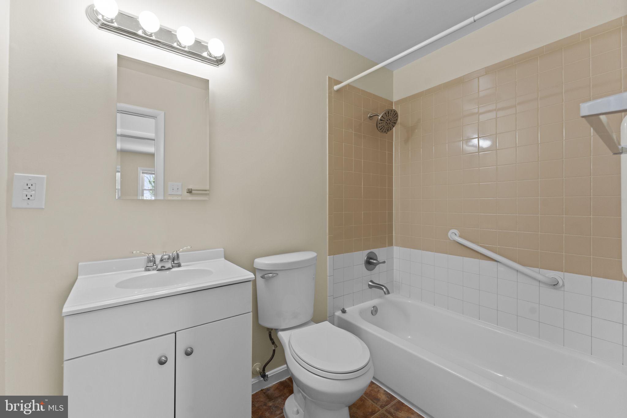 3003 Raymond Court Fort Washington, MD 20744 - Photo 20 of 30 a bathroom with a sink toilet and shower