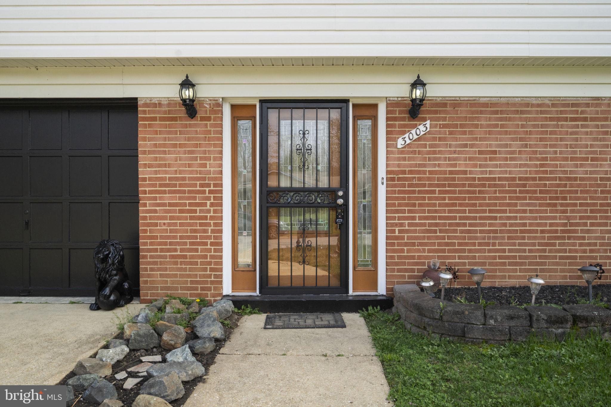 3003 Raymond Court Fort Washington, MD 20744 - Photo 2 of 30 a front view of a house with a yard