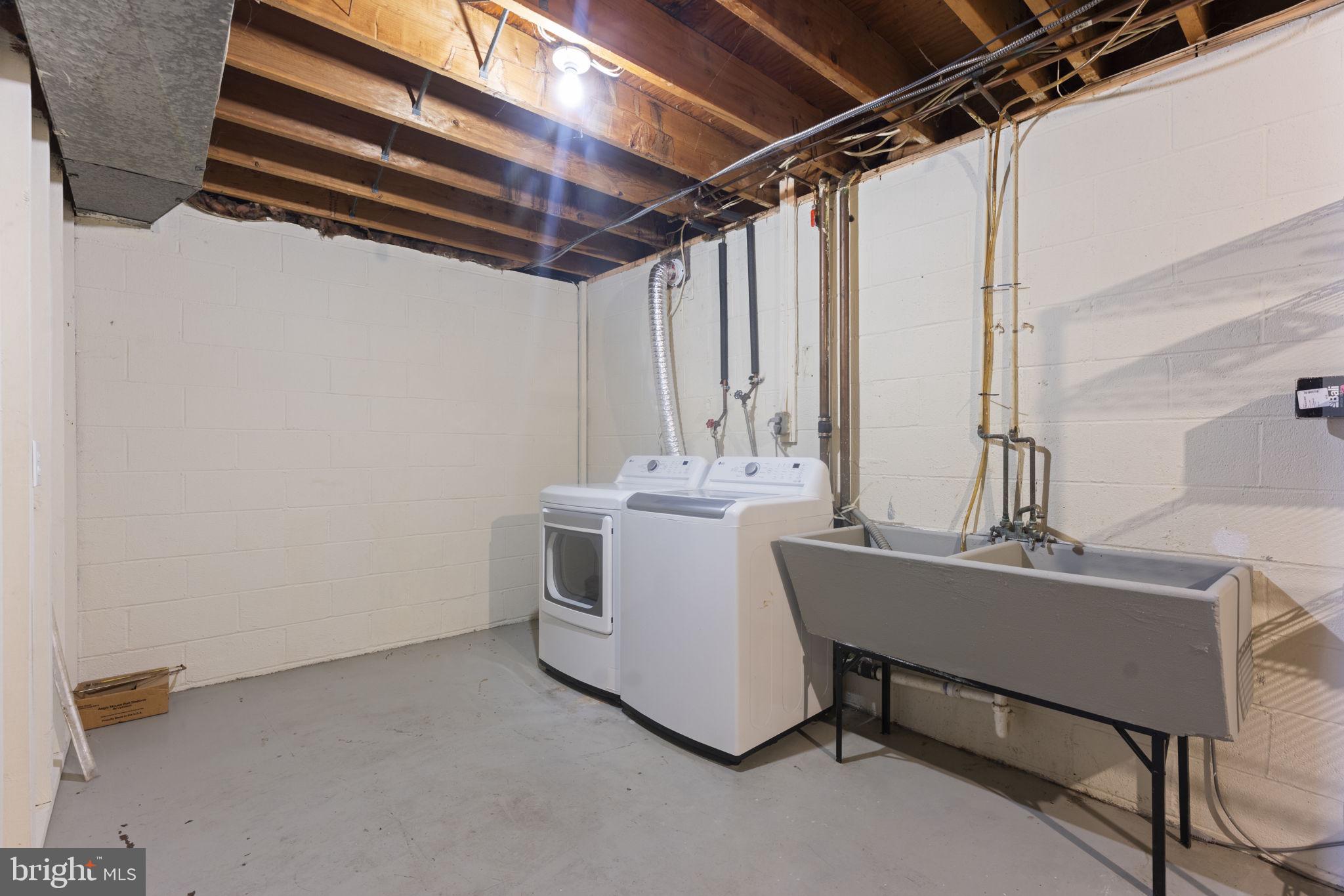 3003 Raymond Court Fort Washington, MD 20744 - Photo 8 of 30 a utility room with a sink a washer and dryer
