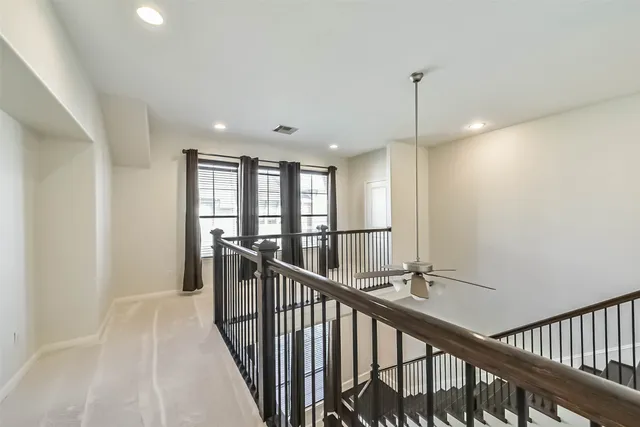 a view of a hallway with windows