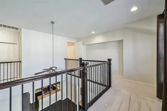 a view of staircase with lots of wooden floor