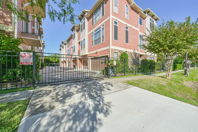 a view of a park with large trees