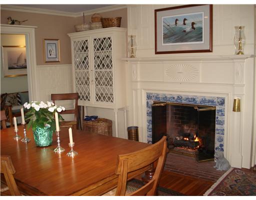 109 Sakonnet Point Road Little Compton, RI 02837 - Photo 7 of 11 Dining Room. Beautiful builtin cabinets, leaded windows and delf tile surround the fireplace.