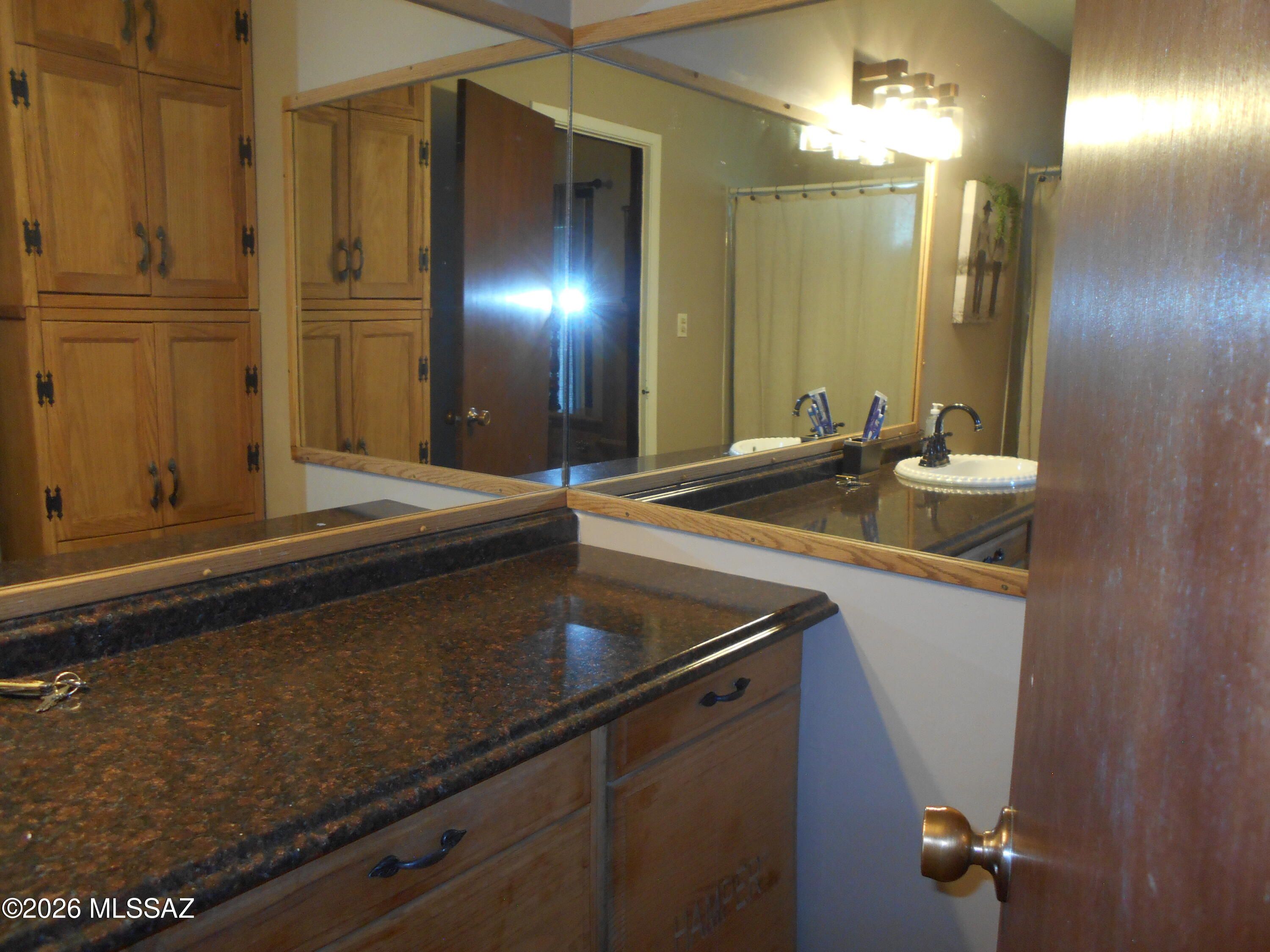 1201 East Old Stewart Road Willcox, AZ 85643 - Photo 11 of 49 a bathroom with a sink and a mirror