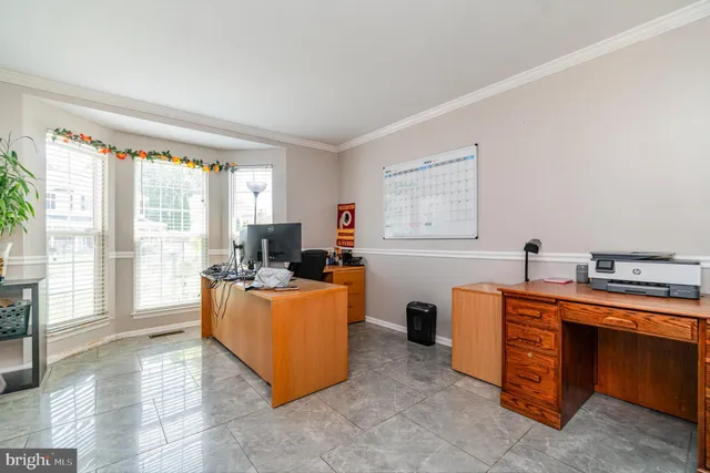 a bedroom with a large bed and a flat screen tv