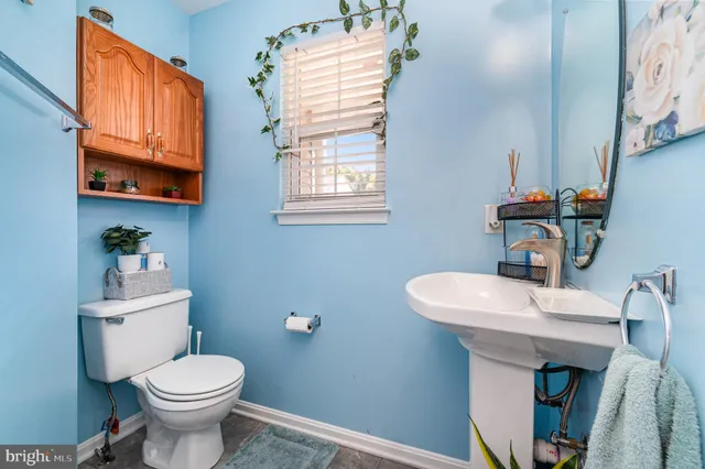 a spacious bathroom with a tub a double vanity sink and a mirror