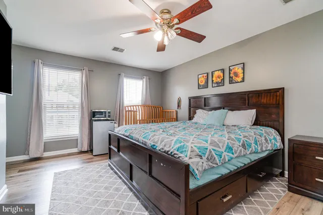 a bathroom with a tub shower and a sink