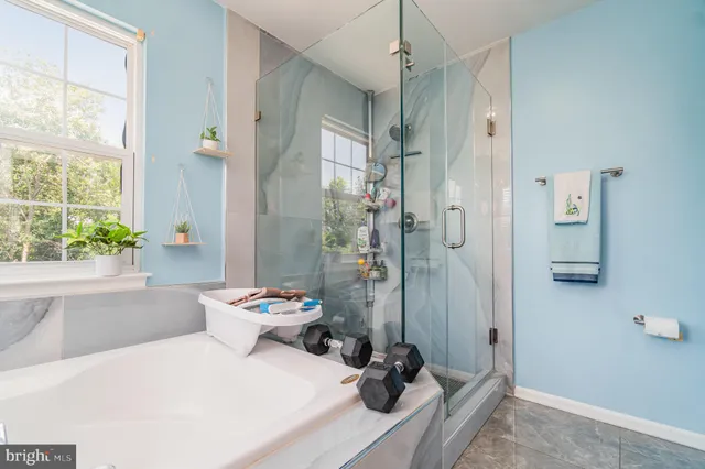 a room with gym equipment and a flat screen tv