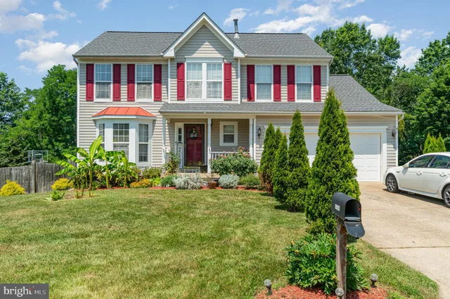 a kitchen with stainless steel appliances granite countertop a refrigerator stove microwave and sink