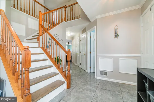 a kitchen with stainless steel appliances a sink a stove a microwave a sink a refrigerator and cabinets