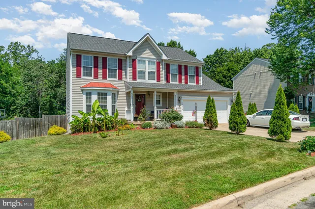 a view of swimming pool with a bench in a patio