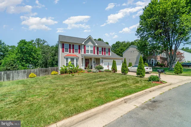 a view of a backyard with a swimming pool