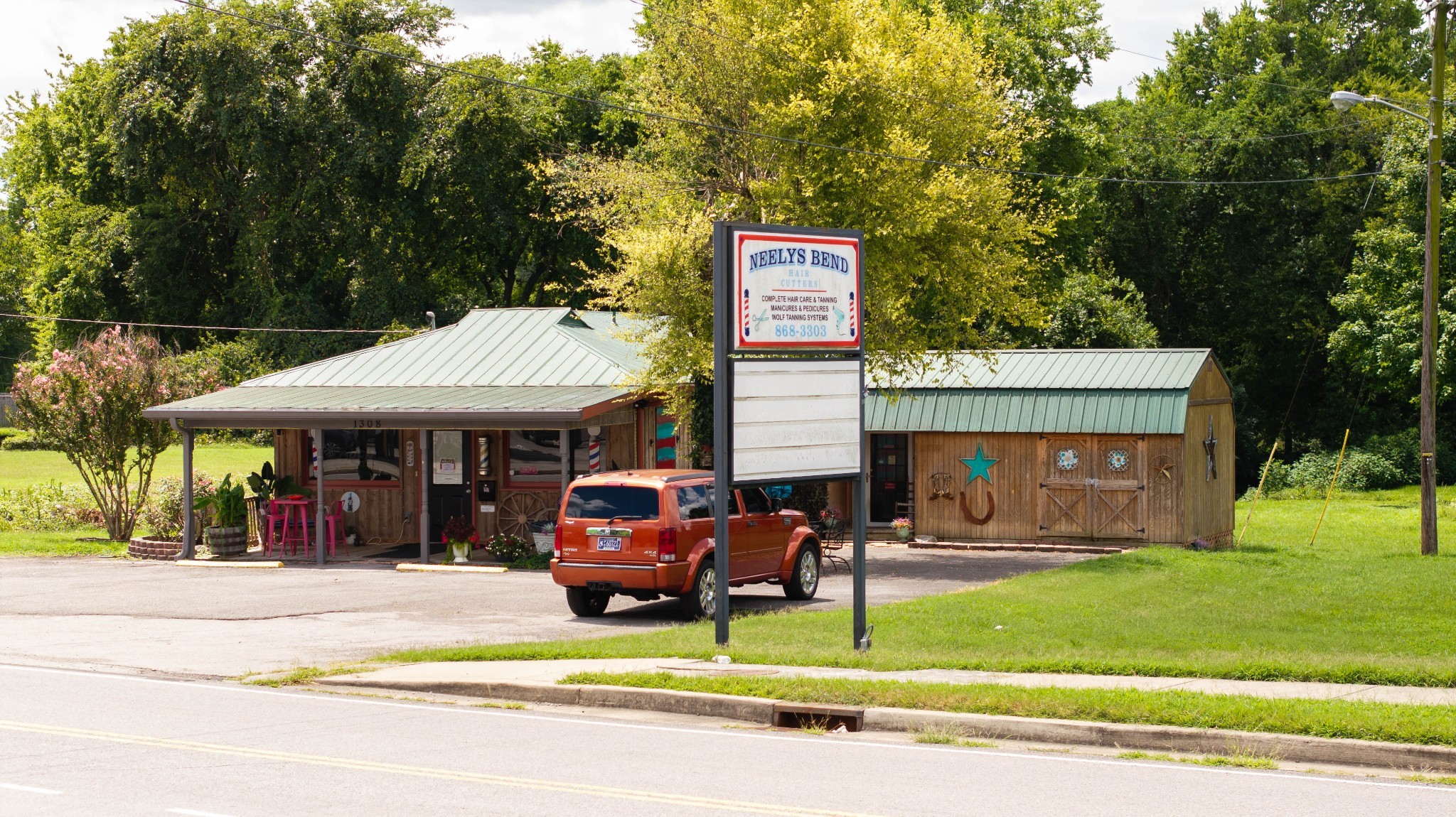 1308 Neelys Bend Road Madison, TN 37115 - Photo 12 of 55 a view of a house with a yard fire pit table and chairs
