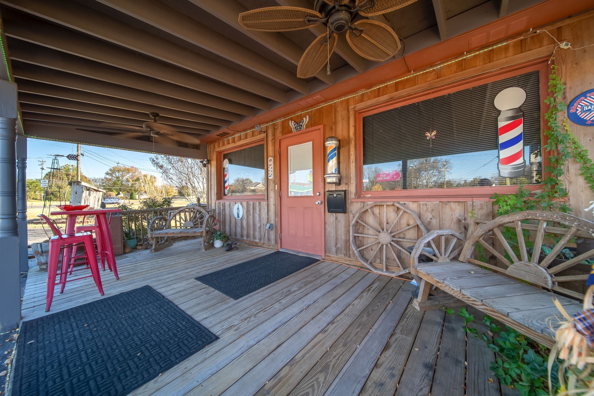 1308 Neelys Bend Road Madison, TN 37115 - Photo 5 of 55 a view of a patio with table and chairs with wooden floor and fence