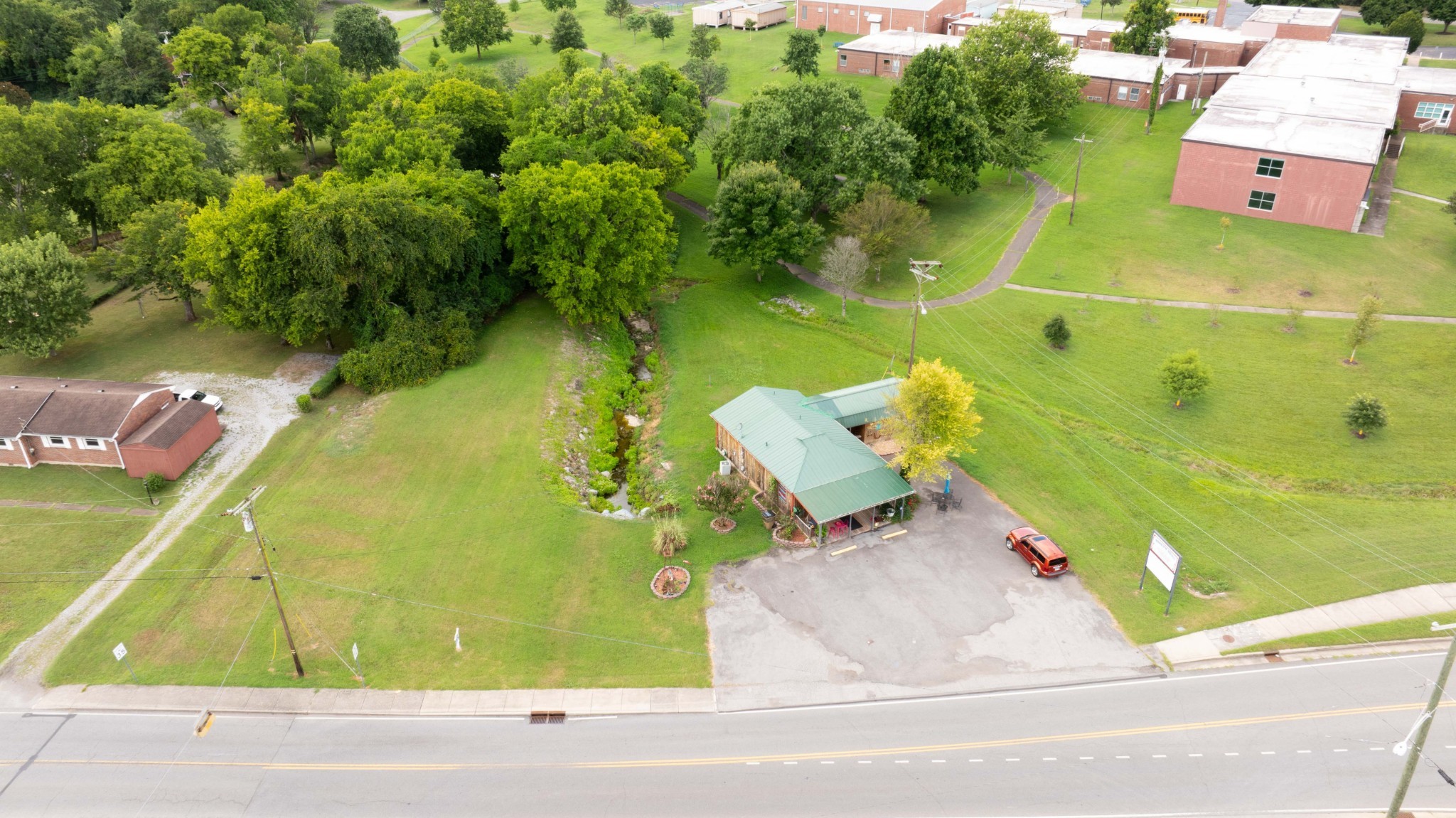 1308 Neelys Bend Road Madison, TN 37115 - Photo 55 of 55 an aerial view of a house with a yard and trees