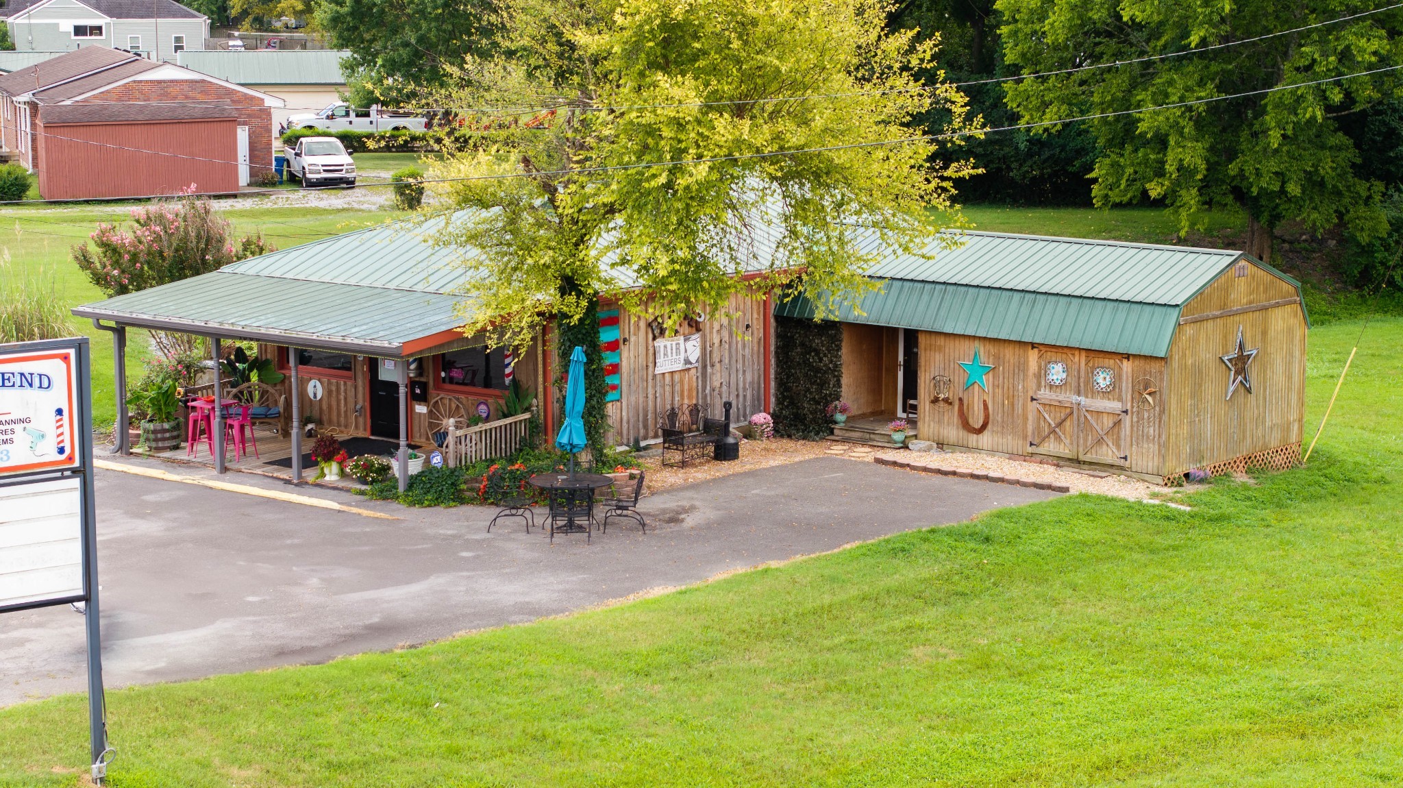 1308 Neelys Bend Road Madison, TN 37115 - Photo 7 of 55 a view of a park with plants and a table and chairs