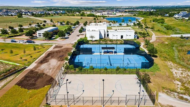 an aerial view of a house with a swimming pool yard and outdoor seating