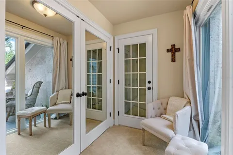 a bedroom with furniture and a window