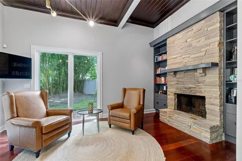 a bathroom with a granite countertop toilet sink and mirror