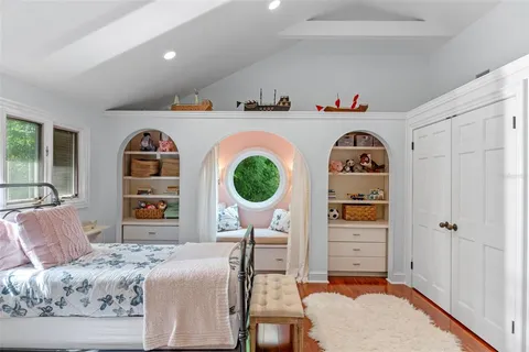 a view of a backyard with plants and a patio