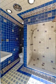 an aerial view of a house with a yard and outdoor seating