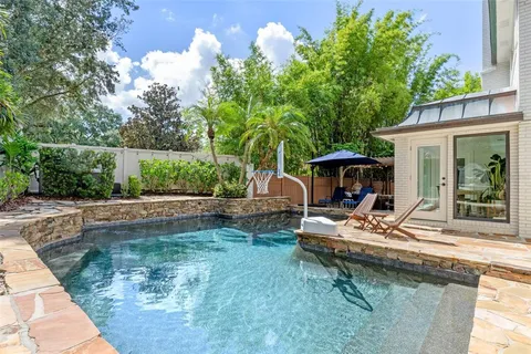 an aerial view of a house with a lake view