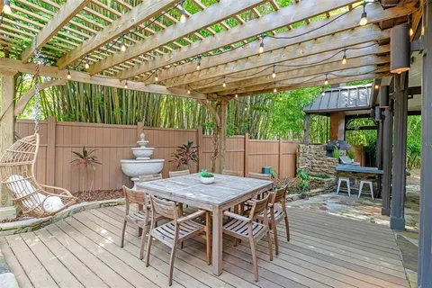 a view of a house with a yard patio and swimming pool