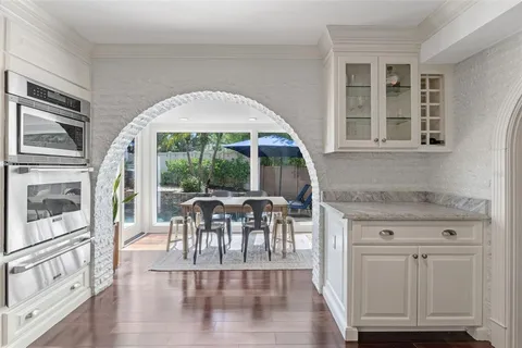 a view of an outside dining space with furniture window