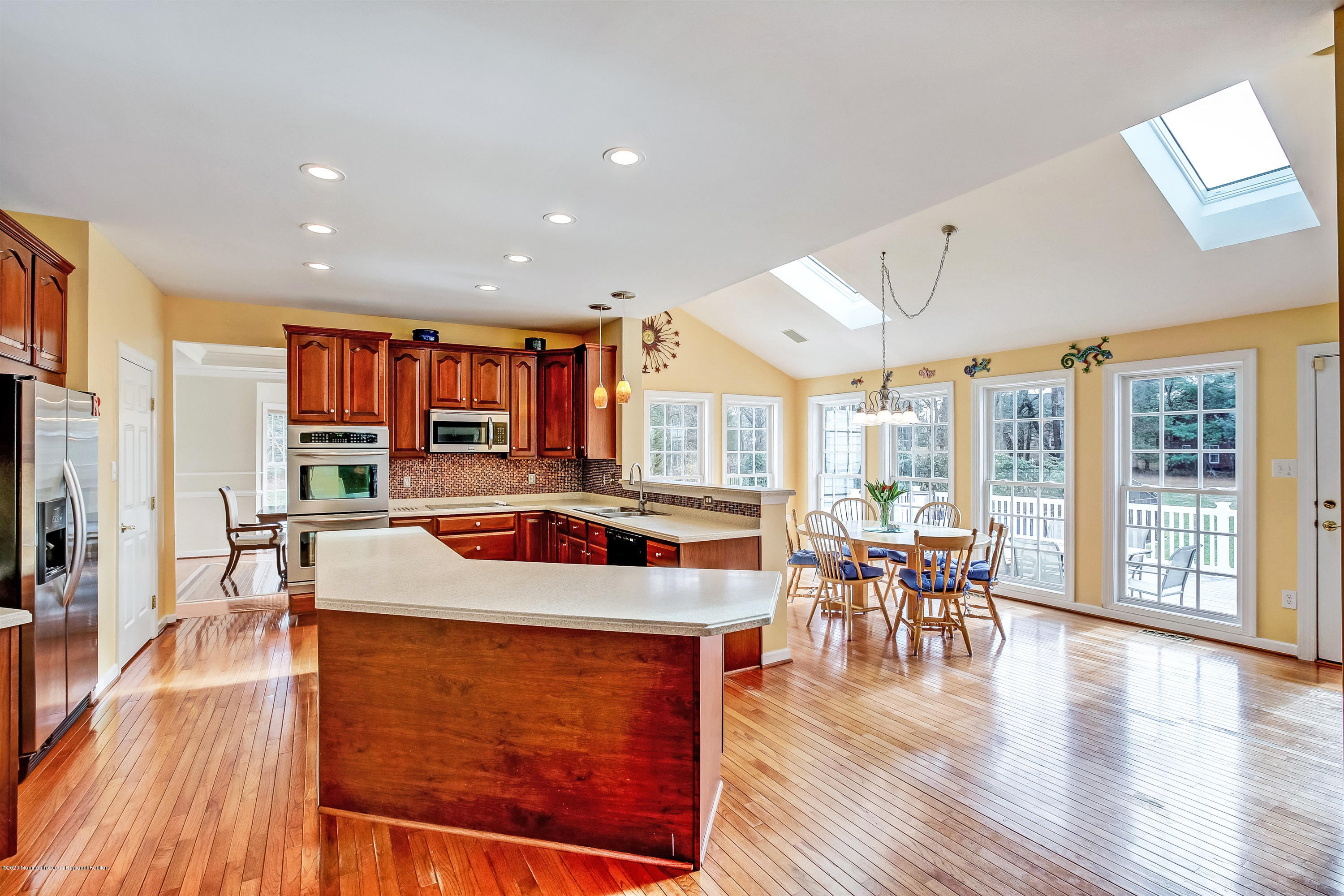 2801 Colonial Drive Wall, NJ 07719 - Photo 11 of 43 an open kitchen with a table and chairs in it