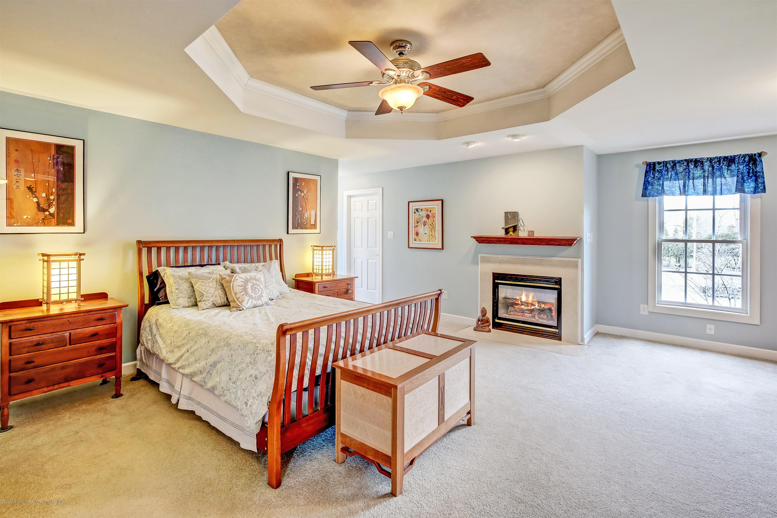 2801 Colonial Drive Wall, NJ 07719 - Photo 21 of 43 a spacious bedroom with a bed and a chandelier