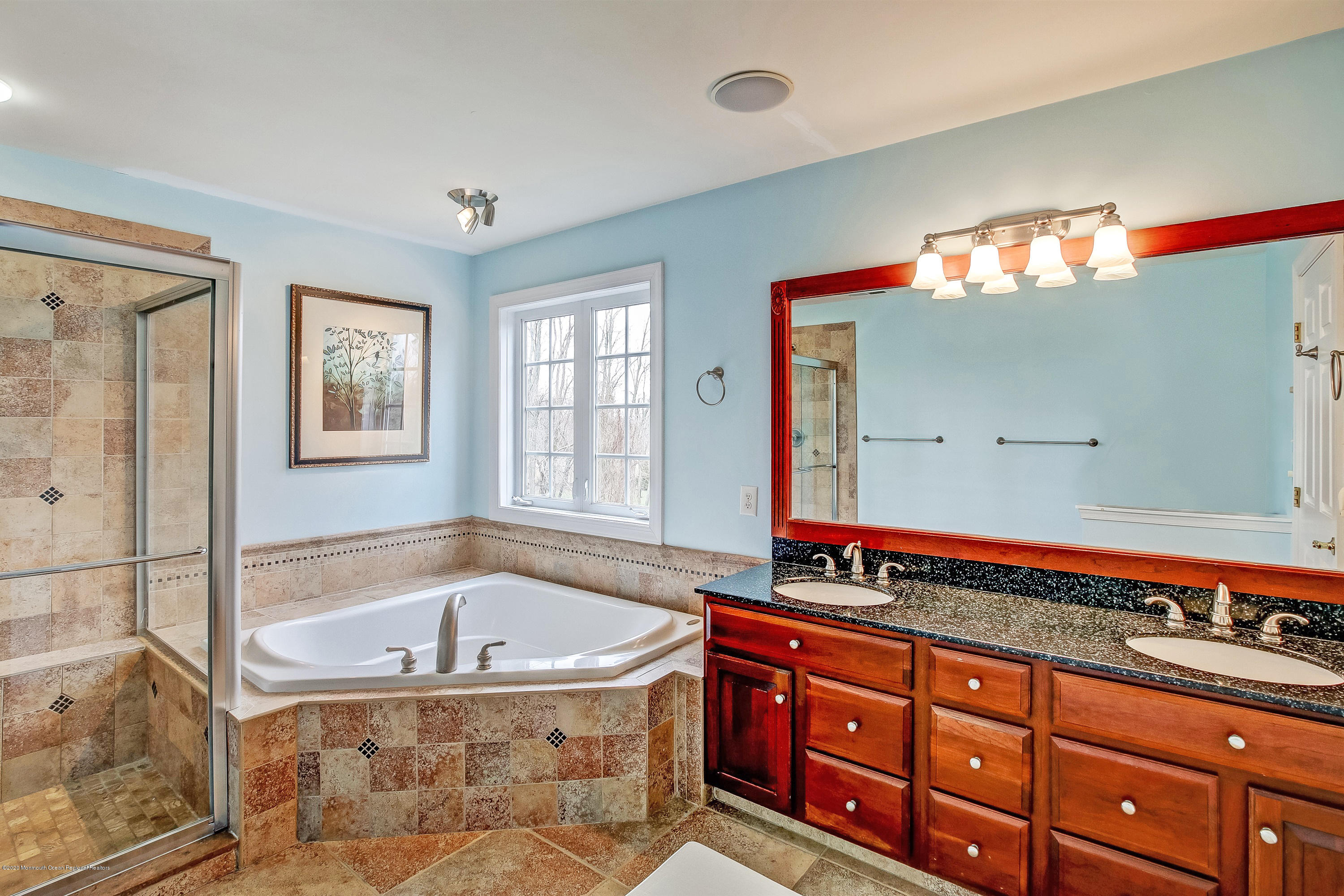 2801 Colonial Drive Wall, NJ 07719 - Photo 23 of 43 a bathroom with a granite countertop tub sink and mirror