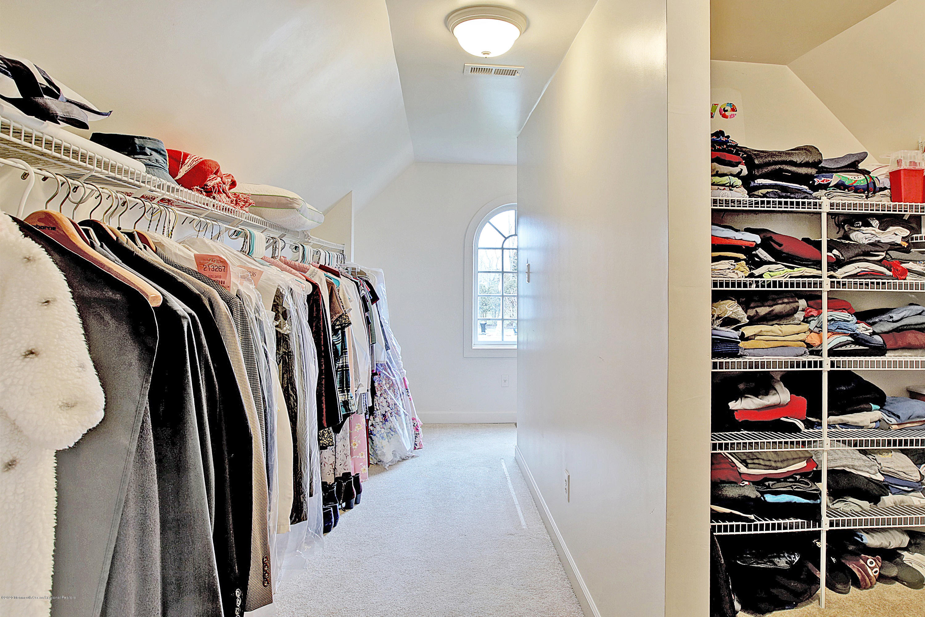 2801 Colonial Drive Wall, NJ 07719 - Photo 26 of 43 a view of walk in closet with clothes and shoes