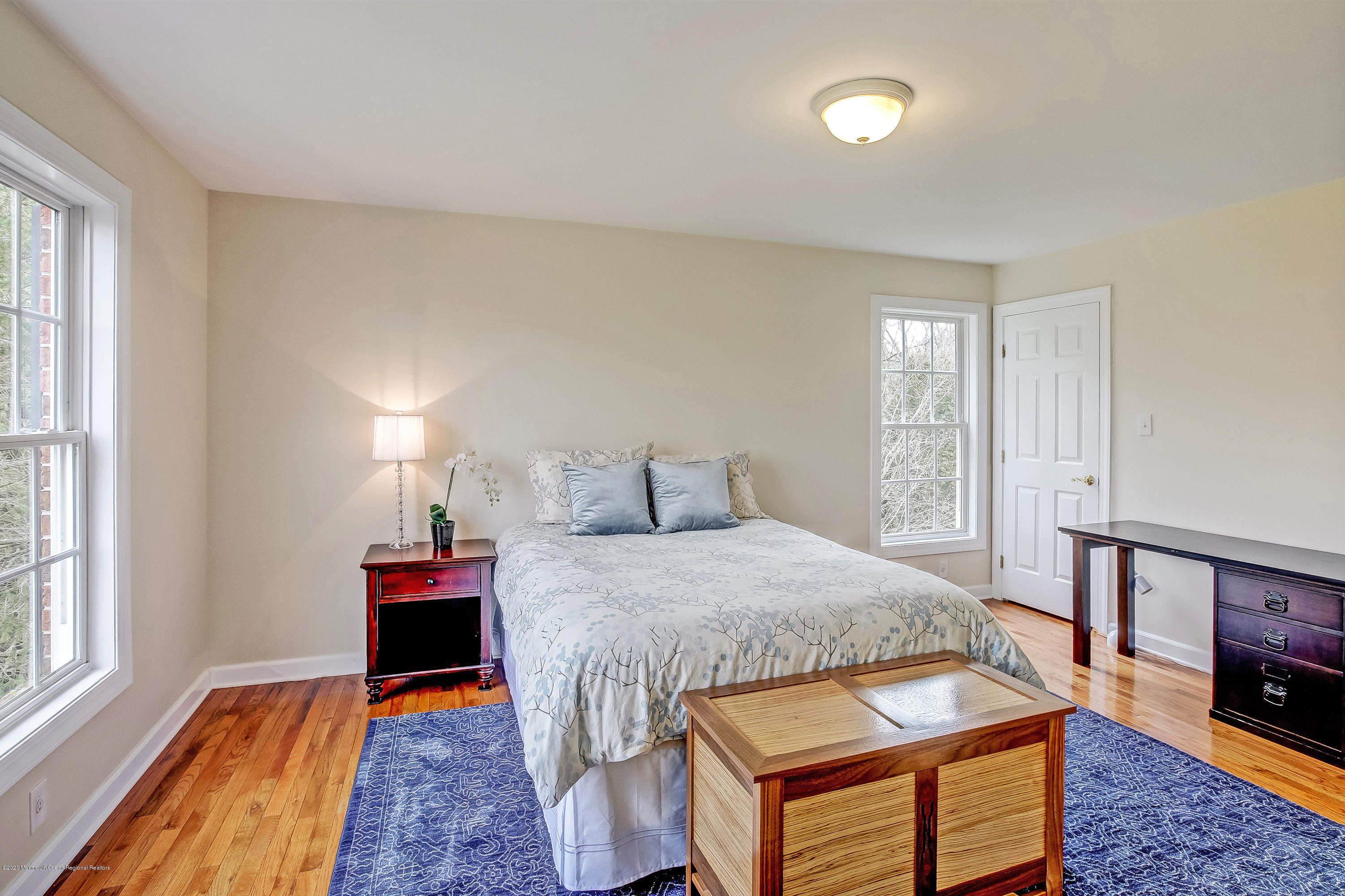 2801 Colonial Drive Wall, NJ 07719 - Photo 27 of 43 a bedroom with a bed and a tv on table