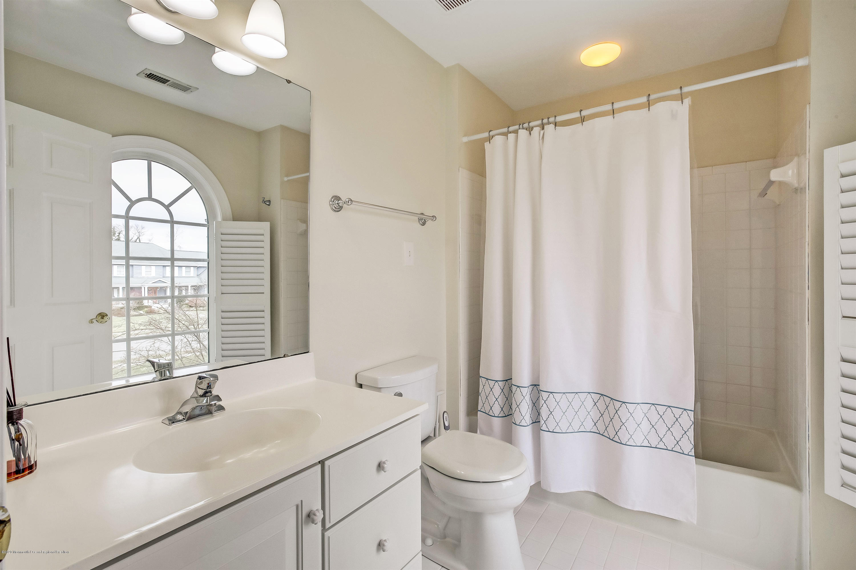 2801 Colonial Drive Wall, NJ 07719 - Photo 28 of 43 a bathroom with a sink toilet a mirror and shower