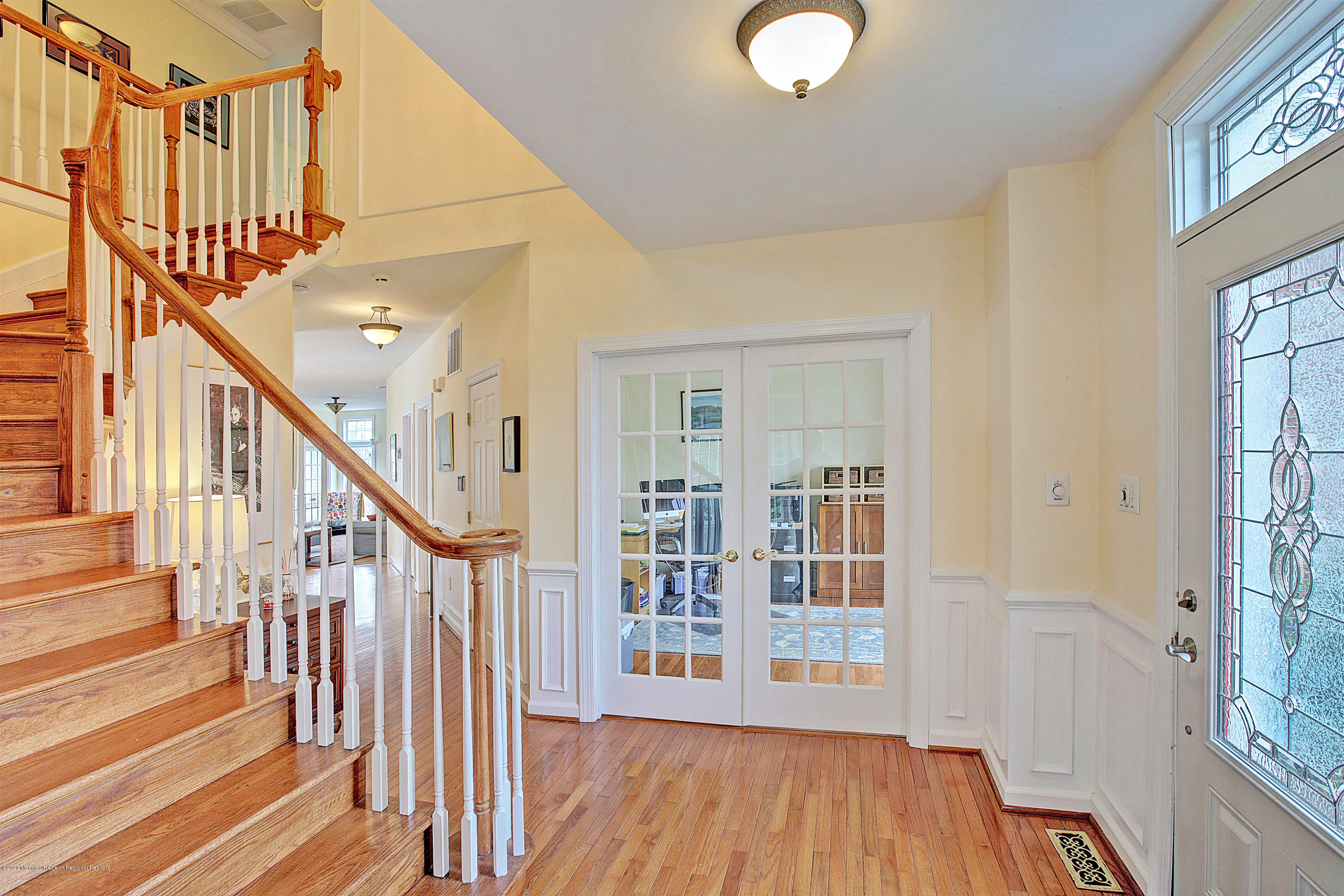 2801 Colonial Drive Wall, NJ 07719 - Photo 3 of 43 a view of a hallway with wooden floor and staircase